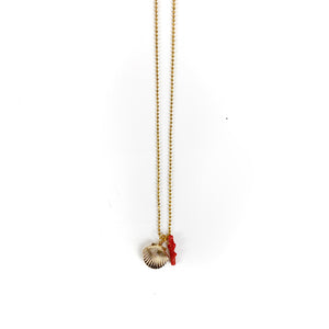 One of the best features of this adorable seashell necklace is that it's also a locket. Open the seashell and put a tiny picture or keepsake. Also on the gold beaded chain is a tiny red coral charm, too. Gunner & Lux's necklace makes a perfect gift for any child. 